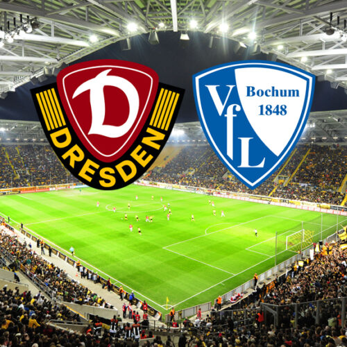 Ein breites, horizontales Bild zeigt ein Fußballstadion, das voll von Fans ist, die gelbe Trikots tragen. Auf dem Spielfeld sind Fußballspieler zu sehen. Am oberen Rand des Bildes, in der Mitte, befinden sich zwei Logos. Das linke Logo ist das Wappen von Dynamo Dresden, das rechte Logo ist das Wappen des VfL Bochum.