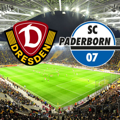 Ein Weitwinkelbild eines Fußballstadions, gefüllt mit jubelnden Fans. Über dem Spielfeld schweben die Logos zweier Fußballvereine: Dynamo Dresden (links, dunkelrot und gelb mit einem „D“) und SC Paderborn 07 (rechts, blau und weiß mit der Aufschrift „SC Paderborn 07“).
